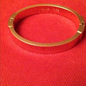 Micheal Kors Exclusive gold- tone bangle.
